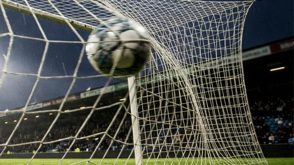 Voetbalnet met bal die erin vliegt tijdens een wedstrijd